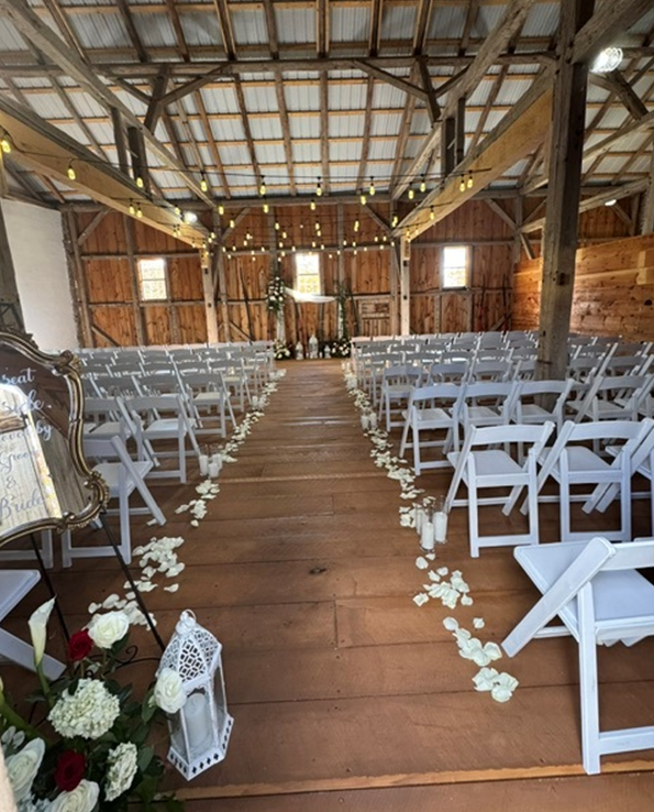 The Bank Barn set for a ceremony under string lights