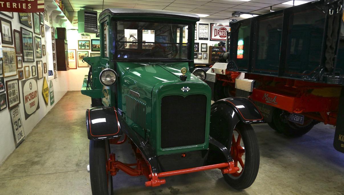 Restored antique Mack trucks on display in the Mack Truck Legacy Museum