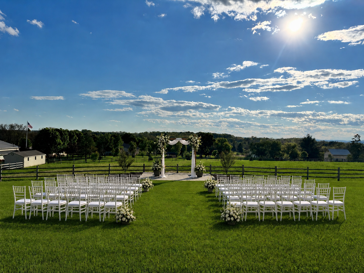 A wedding ceremony arch on the lawn at The Museum at Hoppenville